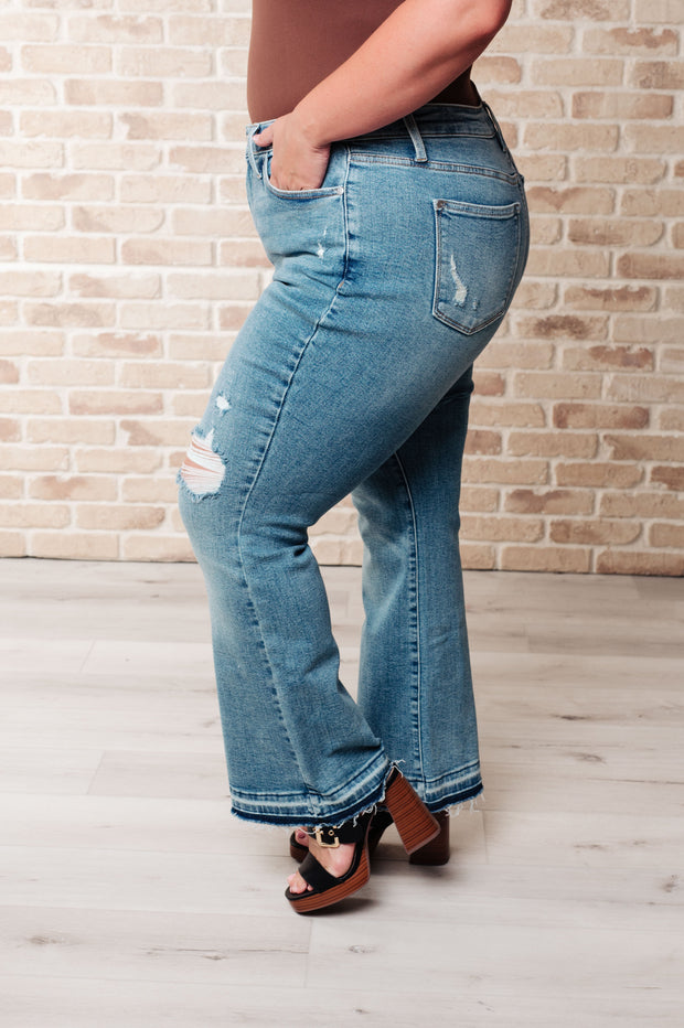 JUDY BLUE Isla Mid Rise Distressed Released Hem Bootcut Jeans